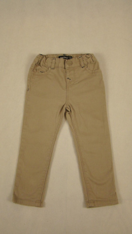 Beżowe spodnie jeansowe dla dziewczynki 86