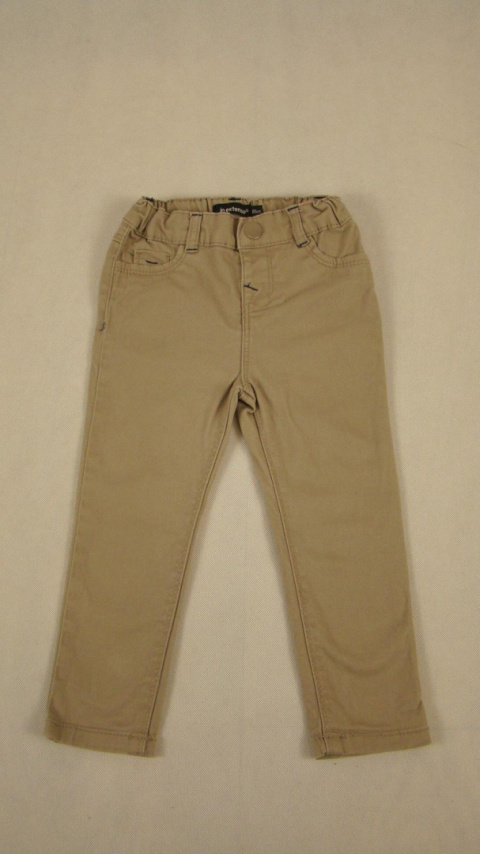 Beżowe spodnie jeansowe dla dziewczynki 86